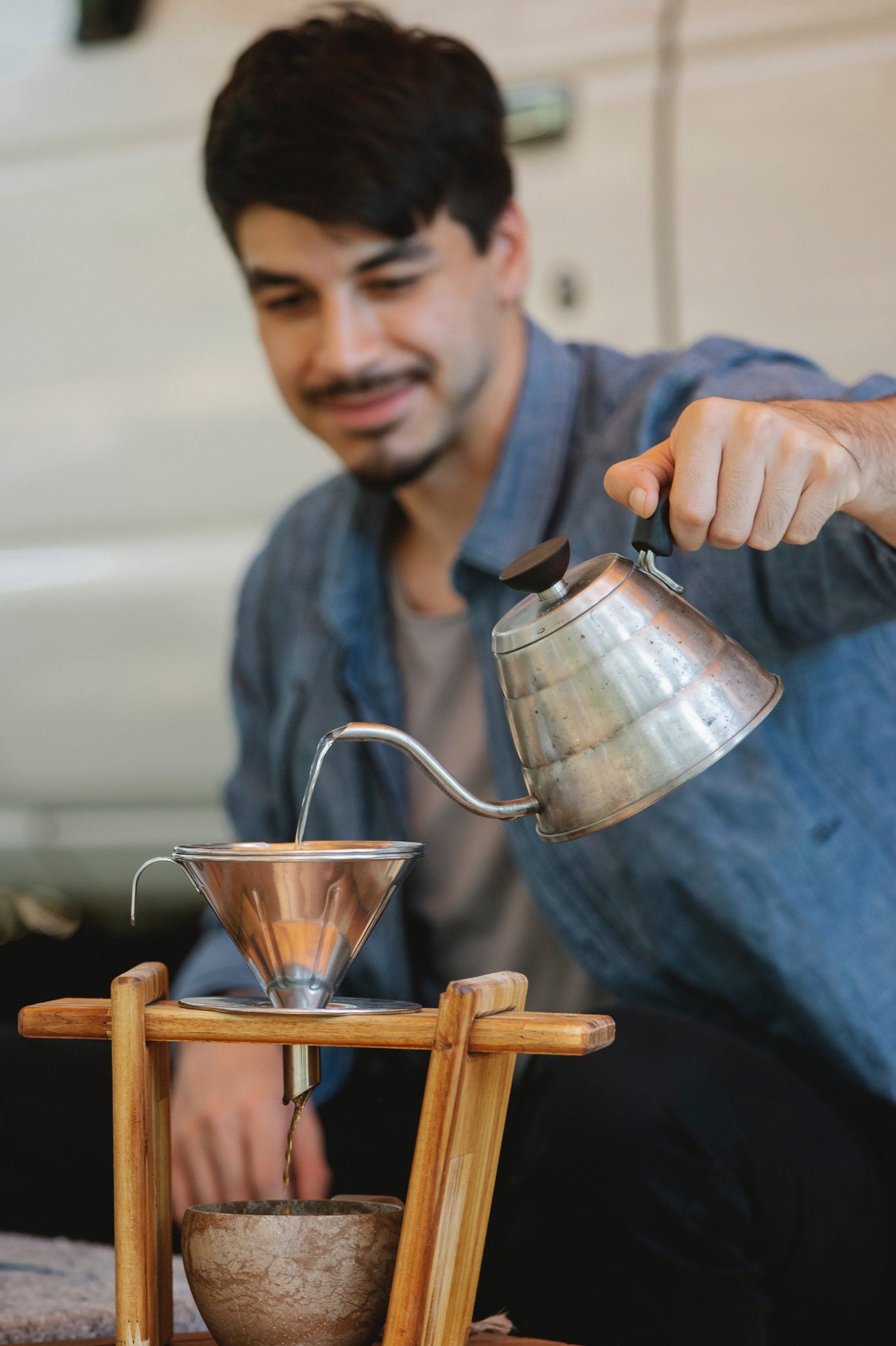 Barrista making a pour-over brew coffee